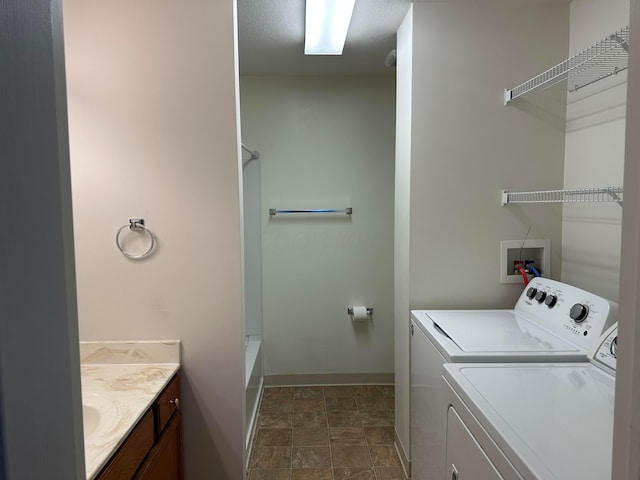 clothes washing area featuring washing machine and clothes dryer