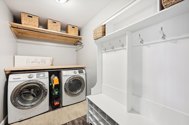 laundry room with dark hardwood / wood-style flooring and separate washer and dryer