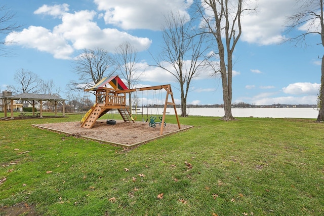 view of playground with a gazebo, a water view, and a yard