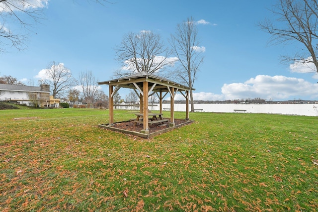 view of yard with a gazebo and a water view