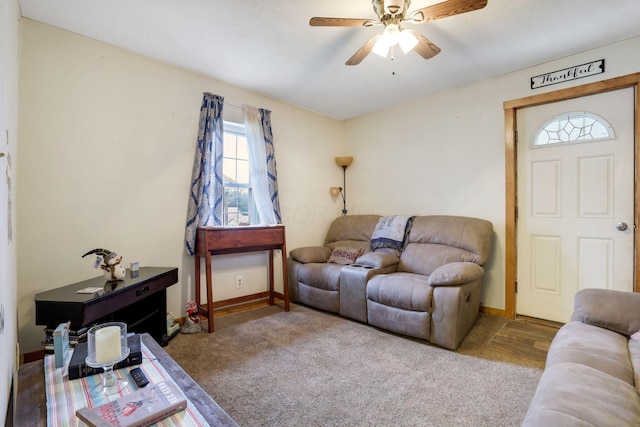 living room featuring ceiling fan and carpet floors