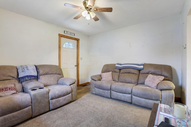 carpeted living room featuring ceiling fan