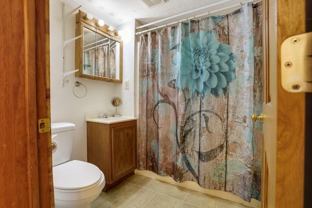 bathroom with vanity, curtained shower, and toilet