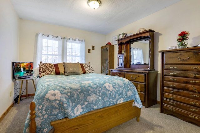 bedroom with light carpet