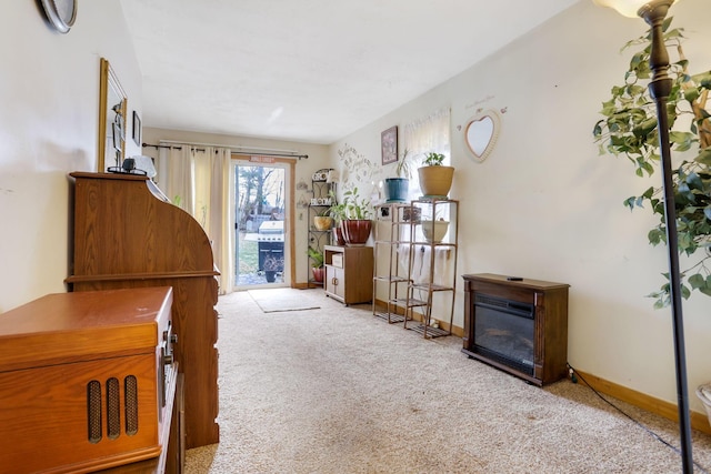 living area with light carpet