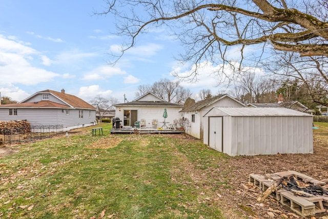 view of yard with a storage shed and a deck