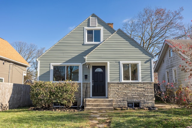 view of front of home with a front lawn