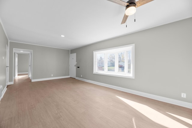 empty room with ceiling fan and light wood-type flooring