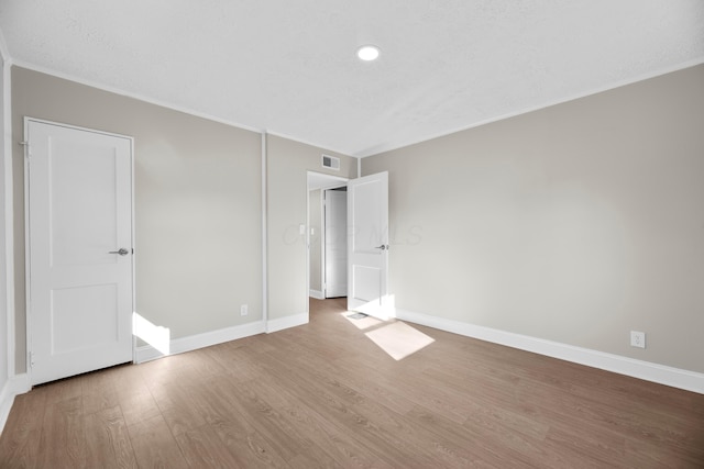 unfurnished bedroom featuring hardwood / wood-style flooring