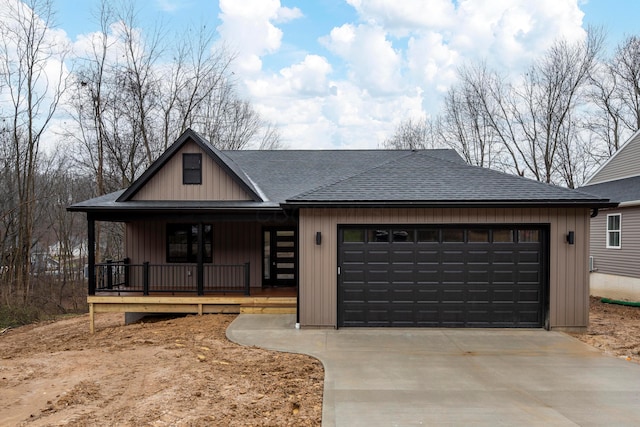 view of front facade with covered porch and a garage