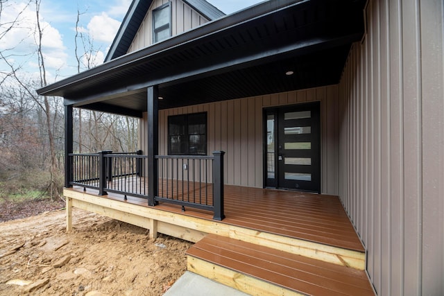 view of exterior entry with a porch