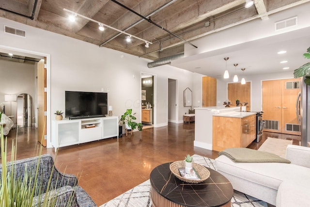 199 S 5th St Unit 406, Columbus, OH 43215 - living room with finished concrete floors, arched walkways, and a high ceiling