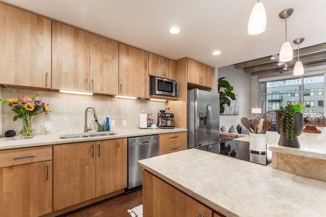 kitchen featuring pendant lighting, sink, decorative backsplash, light brown cabinetry, and stainless steel appliances