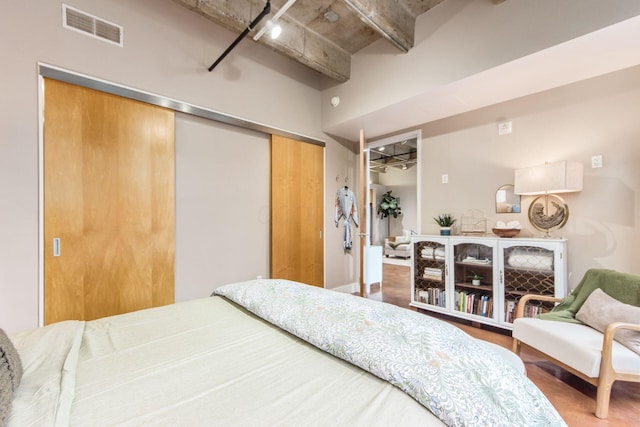 bedroom featuring a closet and wood-type flooring