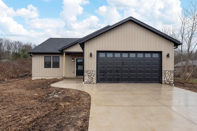 modern inspired farmhouse featuring a garage