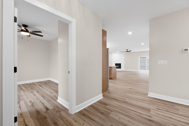 hall with light hardwood / wood-style floors