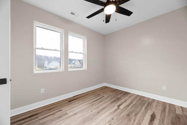 unfurnished room with ceiling fan and light wood-type flooring