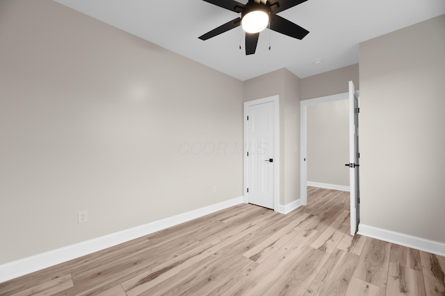 unfurnished bedroom featuring ceiling fan and light hardwood / wood-style flooring