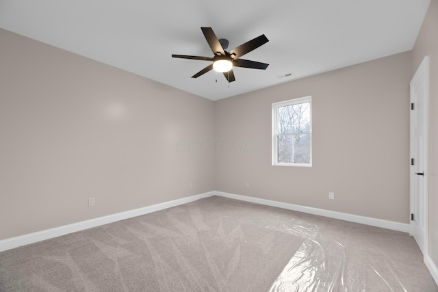 carpeted empty room with ceiling fan