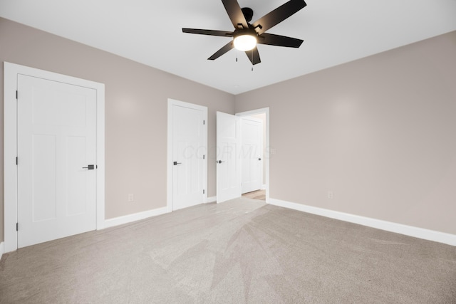 unfurnished bedroom with light carpet and ceiling fan