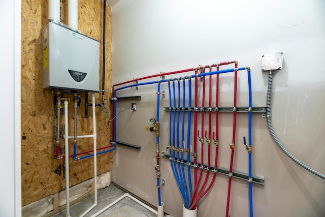 utility room with tankless water heater