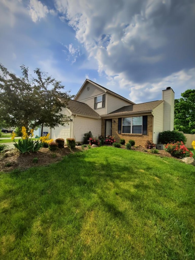 view of front facade featuring a garage and a front yard