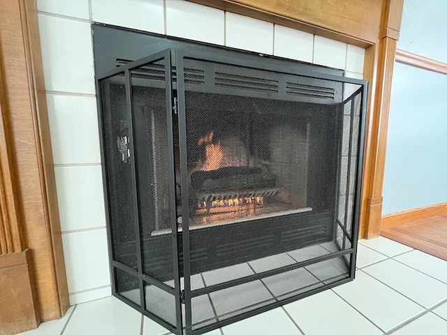 interior details with a tiled fireplace