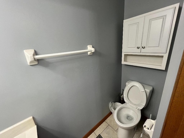 bathroom with tile patterned floors and toilet