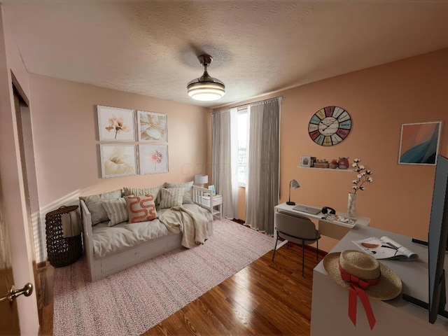 interior space with hardwood / wood-style floors and a textured ceiling