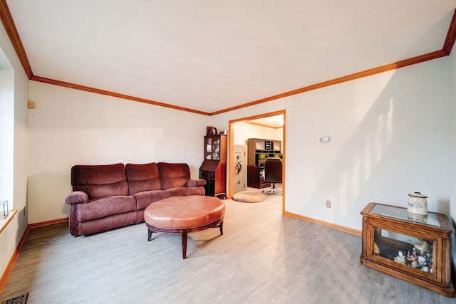 living room with crown molding and hardwood / wood-style floors