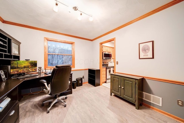 home office featuring ornamental molding and light hardwood / wood-style floors