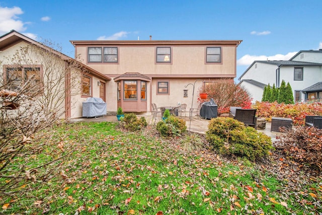 rear view of property with a patio area