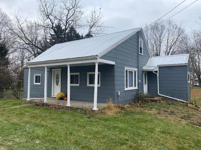 view of front of home with a front lawn and a porch