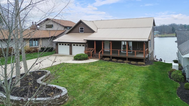 view of front of property with covered porch, a water view, and a front lawn