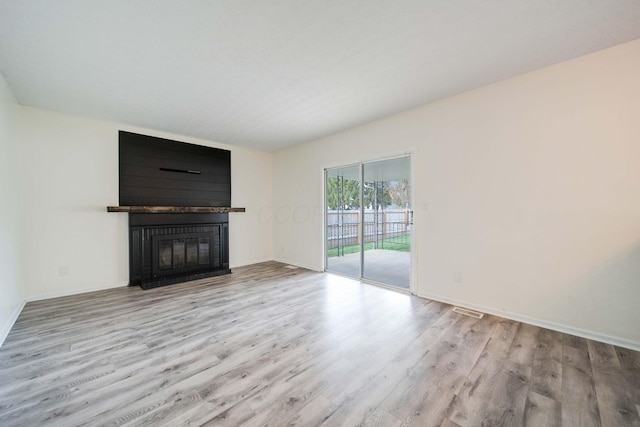 unfurnished living room with light wood-type flooring