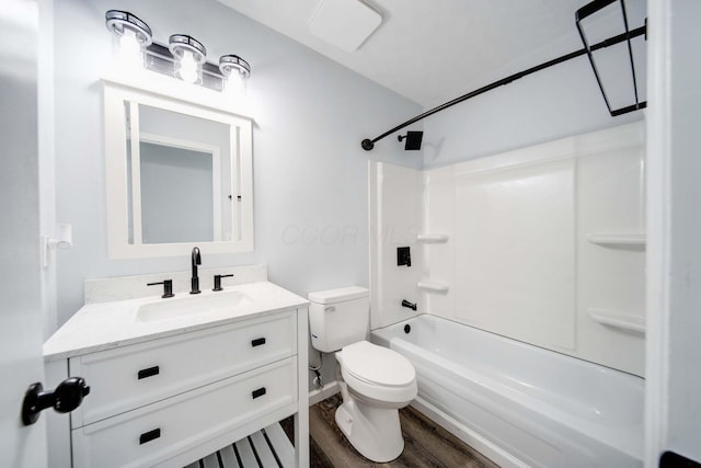 full bathroom featuring vanity, toilet, wood-type flooring, and bathtub / shower combination