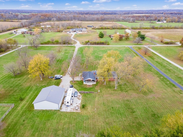 birds eye view of property with a rural view