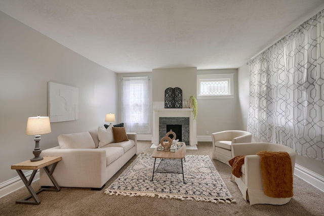 living room featuring carpet flooring and a healthy amount of sunlight