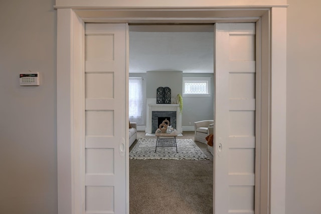 corridor with carpet flooring