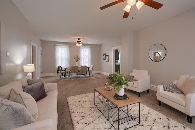 living room featuring carpet floors and ceiling fan