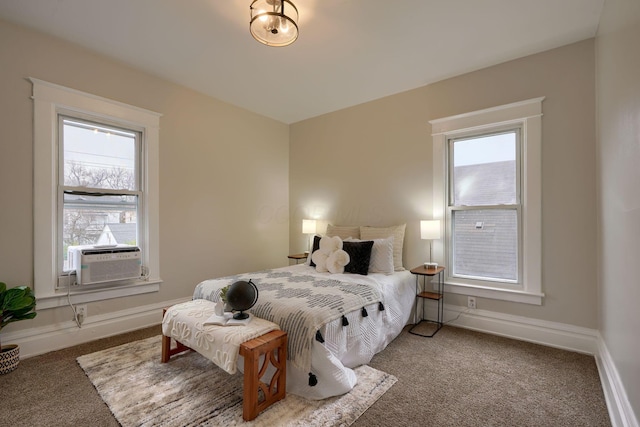 bedroom featuring carpet flooring, cooling unit, and multiple windows