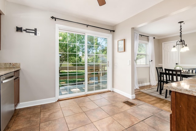 doorway to outside with light hardwood / wood-style flooring, a healthy amount of sunlight, ceiling fan with notable chandelier, and ornamental molding