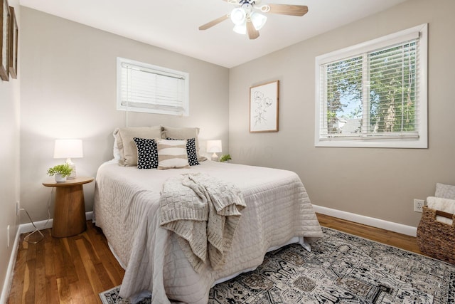 bedroom with hardwood / wood-style flooring and ceiling fan