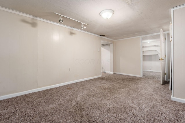 interior space featuring a textured ceiling and carpet floors