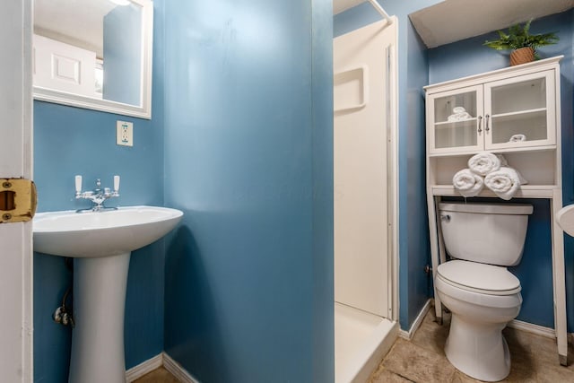 bathroom with tile patterned floors, sink, and toilet