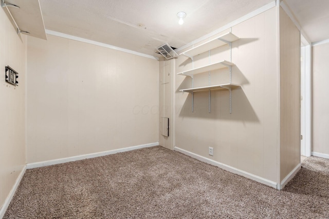 unfurnished room featuring carpet and crown molding