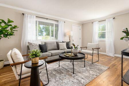 living room with light hardwood / wood-style floors and ornamental molding