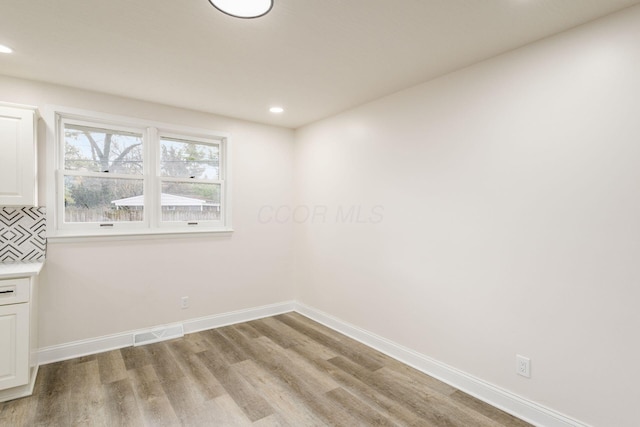 empty room featuring light hardwood / wood-style flooring