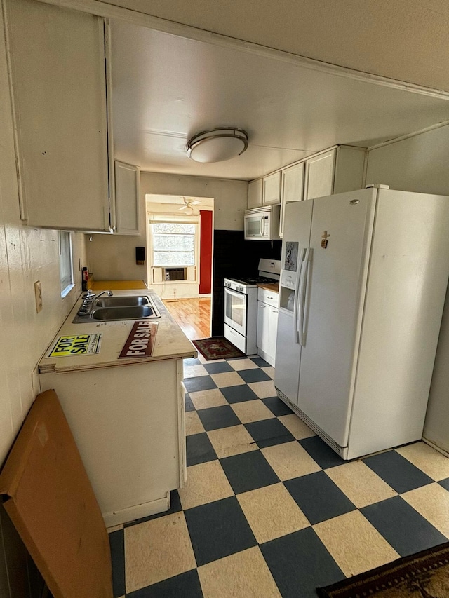 kitchen with sink and white appliances