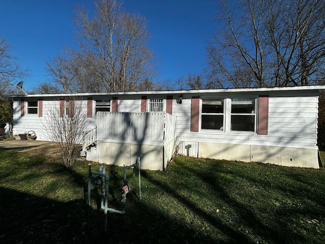 view of home's exterior featuring a lawn